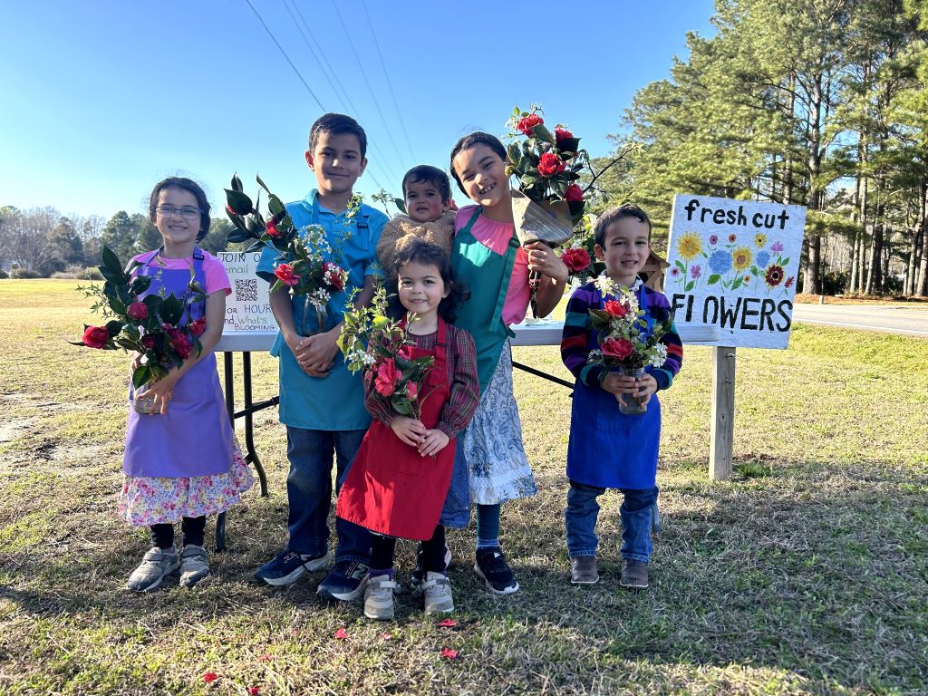 kids with camelia bouquets